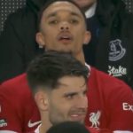 Trent Alexander-Arnold can’t bear to watch and hides his head after being subbed off during Liverpool’s loss to Everton